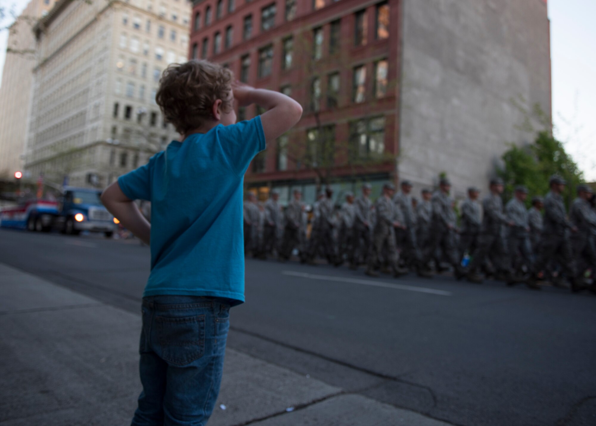 A boy salutes a passing formation of Airmen from Fairchild Air Force Base during the annual Lilac Festival Torchlight Armed Forces Parade May 20, 2017, Spokane, Washington. The estimated annual attendance of the festival is over 150,000 people.
(U.S. Air Force photo / Airman 1st Class Ryan Lackey)