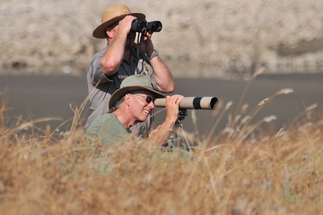 A pair takes a closer look at the wide variety of birds at H.V. Eastman Lake.