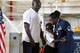 Master Sgt. Wiley Daniels, a Logistics Management Specialist assigned to the 307th Maintenance Group, presents her son, Willie Daniels Jr., with the Military Child Medal during her retirement ceremony June 3, 2017 at Barksdale Air Force Base, La. A large gathering of Daniel’s friends and family celebrate her retirement after more than 20 years of service.  (U.S. Air Force photo by Staff Sgt. Callie Ware/Released)