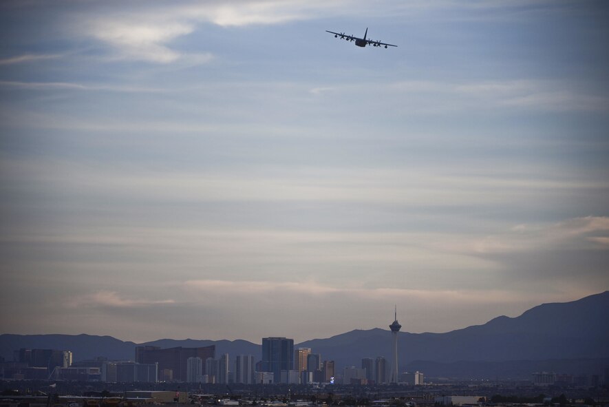 A C-130 Hercules from the 29th Weapons Squadron, Little Rock Air Force Base, Ark., takes off over Las Vegas for a USs Air Force Weapons School training exercise at Nellis Air Force Base, Nev., June 8, 2017. The C-130 is capable of operating in rough terrain and serves as the main transport for troops and equipment for any scenario. (U.S. Air Force photo by Airman 1st Class Andrew D. Sarver/Released)
