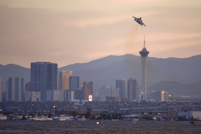 A F-15E Strike Eagle from the 17th Weapons Squadron, Nellis Air Force Base, Nev., takes off over Las Vegas during a US Air Force Weapons School training exercise June 8, 2017. The F-15E uses two crew members, a pilot and a weapon systems officer. (U.S. Air Force photo by Airman 1st Class Andrew D. Sarver/Released)