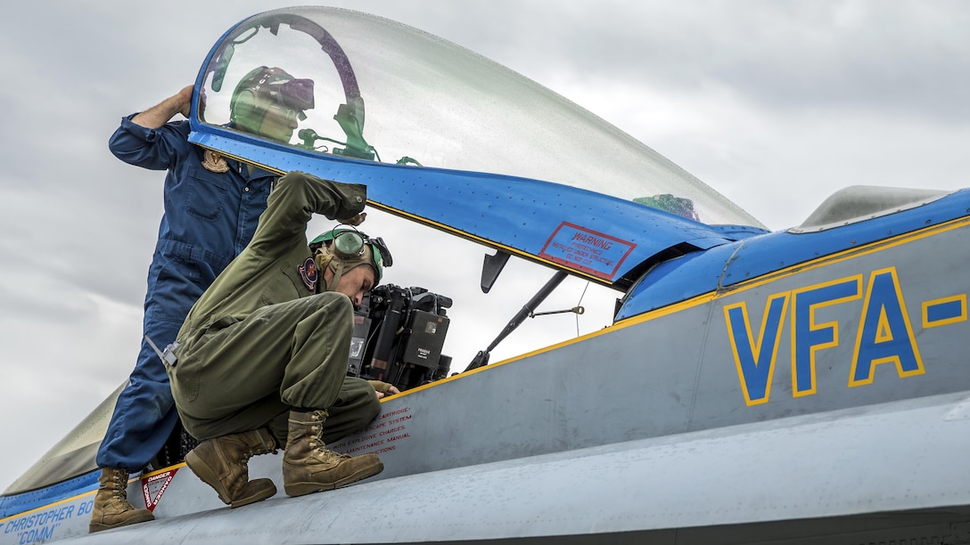 Marines perform maintenance on an F/A-18C Hornet aircraft at Joint Base Elmendorf-Richardson, Alaska, June 19, 2017, during exercise Red Flag-Alaska 17-2. The Marines are assigned to Marine Fighter Attack Squadron 251. Marine Corps photo by Lance Cpl. Koby I. Saunders