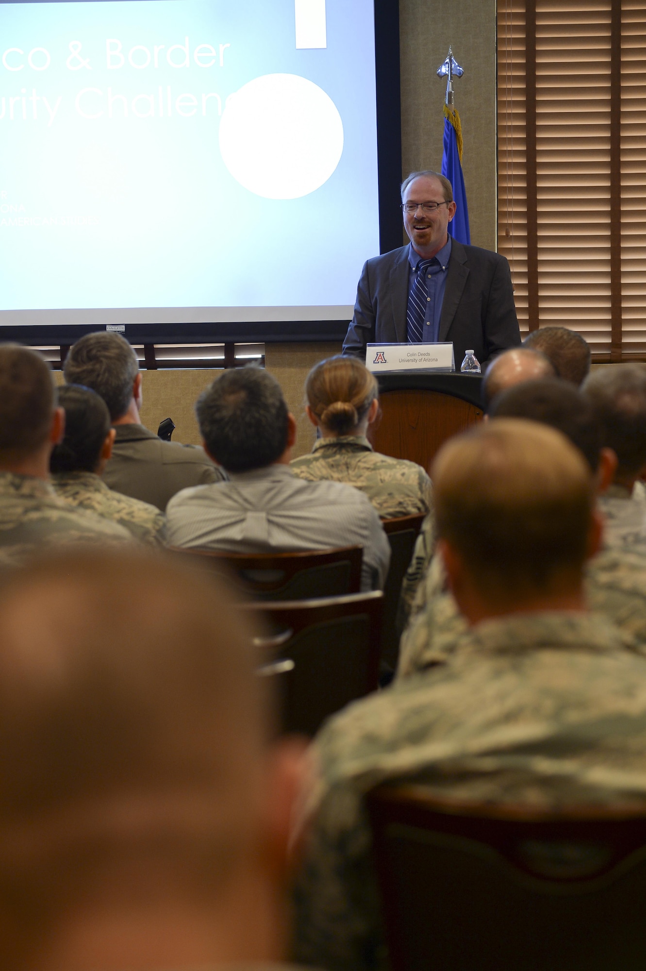 Colin Deeds, University of Arizona Latin American Studies Center assistant director, lectures during a speaker series event at Davis-Monthan Air Force Base, Ariz., June 19, 2017, for the 12th Air Force (Air Forces Southern) Academic Outreach Program with the University of Arizona. Following the event, the University of Arizona officials were given a tour of the 309th Aerospace Maintenance and Regeneration Group, the largest aircraft storage and preservation facility in the world. (U.S. Air Force photo by Staff Sgt. Angela Ruiz)