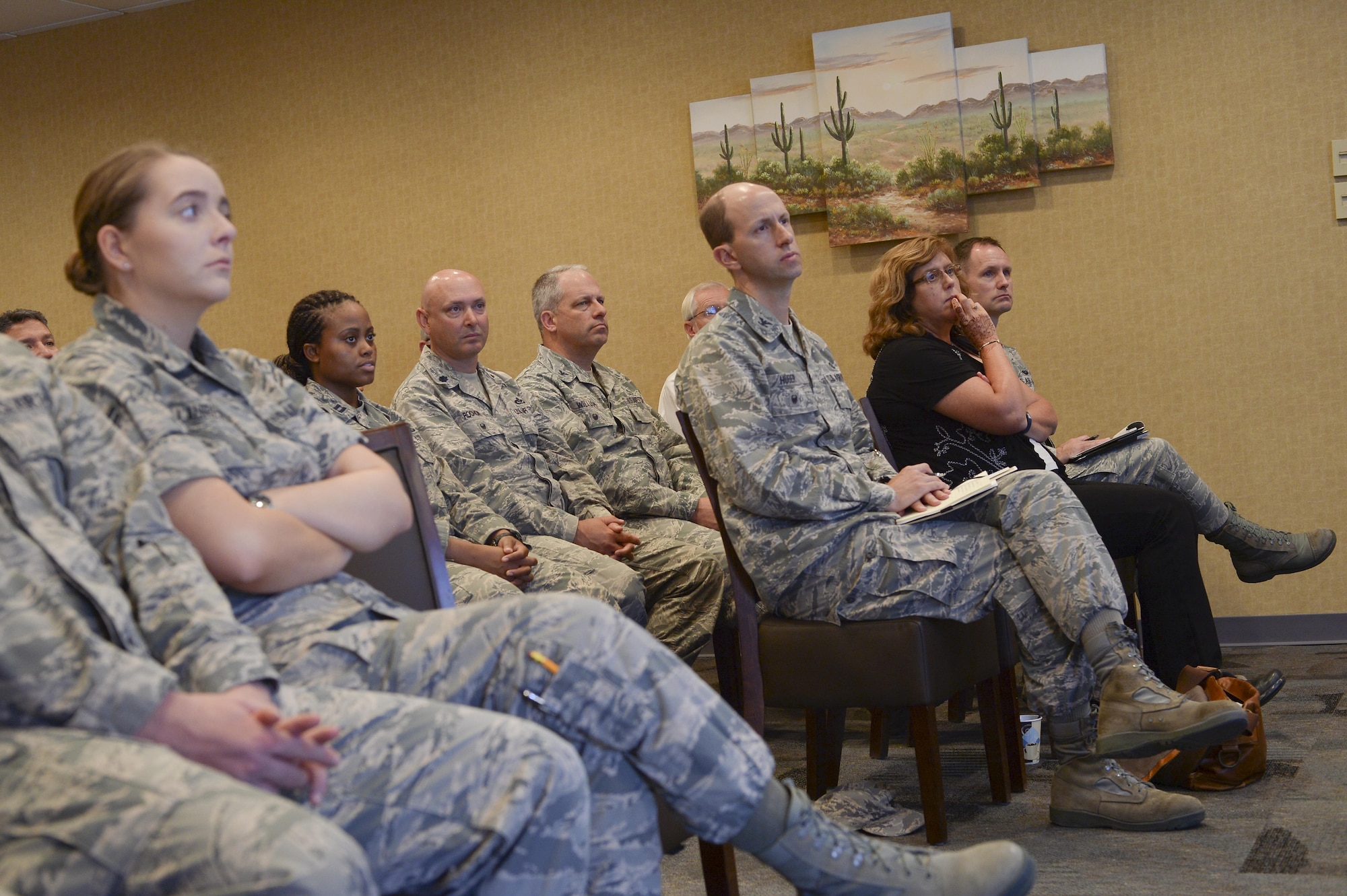 Members of 12th Air Force (Air Forces Southern) and University of Arizona listen as Colin Deeds, University of Arizona Latin American Studies Center assistant director, lectures during a speaker series event at Davis-Monthan Air Force Base, Ariz., June 19, 2017, for the 12th Air Force (Air Forces Southern) Academic Outreach Program with the University of Arizona. The Academic Outreach Program is modeled after U.S Southern Command’s partnership with Florida International University. (U.S. Air Force photo by Staff Sgt. Angela Ruiz)