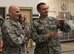 Gen. Carlton D. Everhart II, Air Mobility Command commander, and Col. John Groves, 336th Training Group commander, discuss various logistical issues currently being tackled by the 336th TRG Survival, Evasion, Resistance and Escape water survival training program June 19, 2017, at Fairchild Air Force Base, Washington. Currently, SERE water survival training is being conducted out of Fairchild’s fitness center pool, an area not originally designed to accommodate the complex aspects of the training program, and funding has been requested to create a new facility that will better meet training requirements. (U.S. Air Force photo/Senior Airman Sean Campbell)