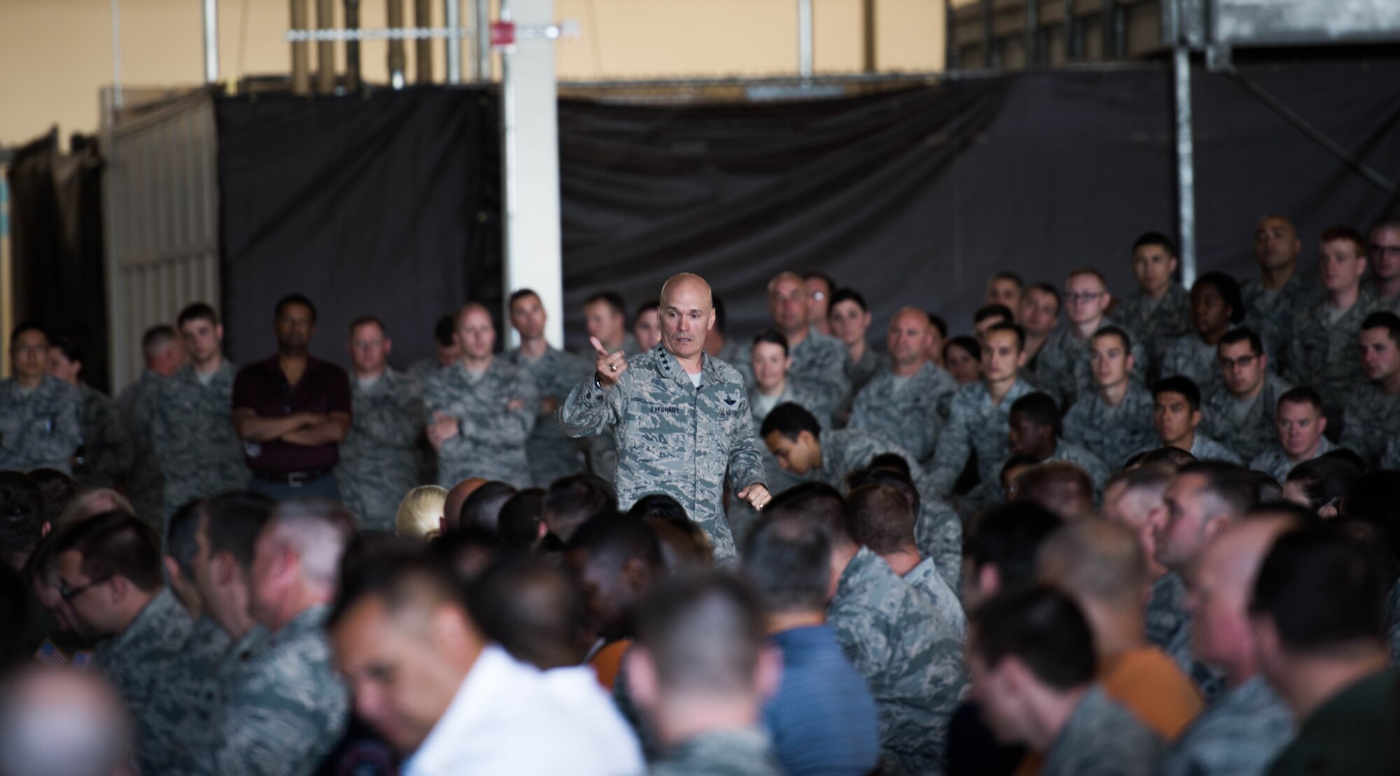 Gen. Carlton D. Everhart II, Air Mobility Command commander, answers questions from Team Fairchild Airmen during an All Call June 20, 2017, at Fairchild Air Force Base, Washington. Everhart provided background to Airmen on various AMC goals and initiatives to improve retention, training and the welfare of Airmen and their families. Everhart encouraged Airmen to openly communicate with leadership to inspire change not only at Fairchild but across the Air Force. (U.S. Air Force photo/Senior Airman Sean Campbell)