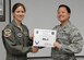 Staff Sgt. Jessica Lu, 47th Communications Squadron client systems technician (right), accepts the “XLer of the week” award from Col. Michelle Pryor, 47th Flying Training Wing vice commander (left), at Laughlin Air Force Base, June 14, 2017. The “XLer” is given to those who consistently make outstanding contributions to their unit, Laughlin and the mission.