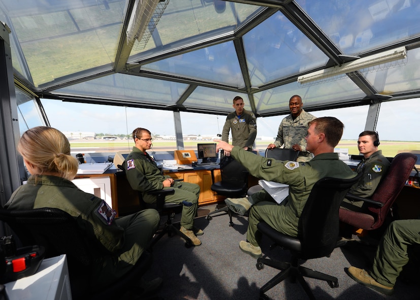 Col. Thomas Shank, 47th Flying Training Wing commander, discusses takeoffs and landings while visiting the Runway Supervisory Unit at Laughlin Air Force Base, June 16, 2017. Leadership had an opportunity to spend time and learn more of what the Airmen do on a day-to-day basis. (U.S. Air Force photo/Airman 1st Class Benjamin N. Valmoja)