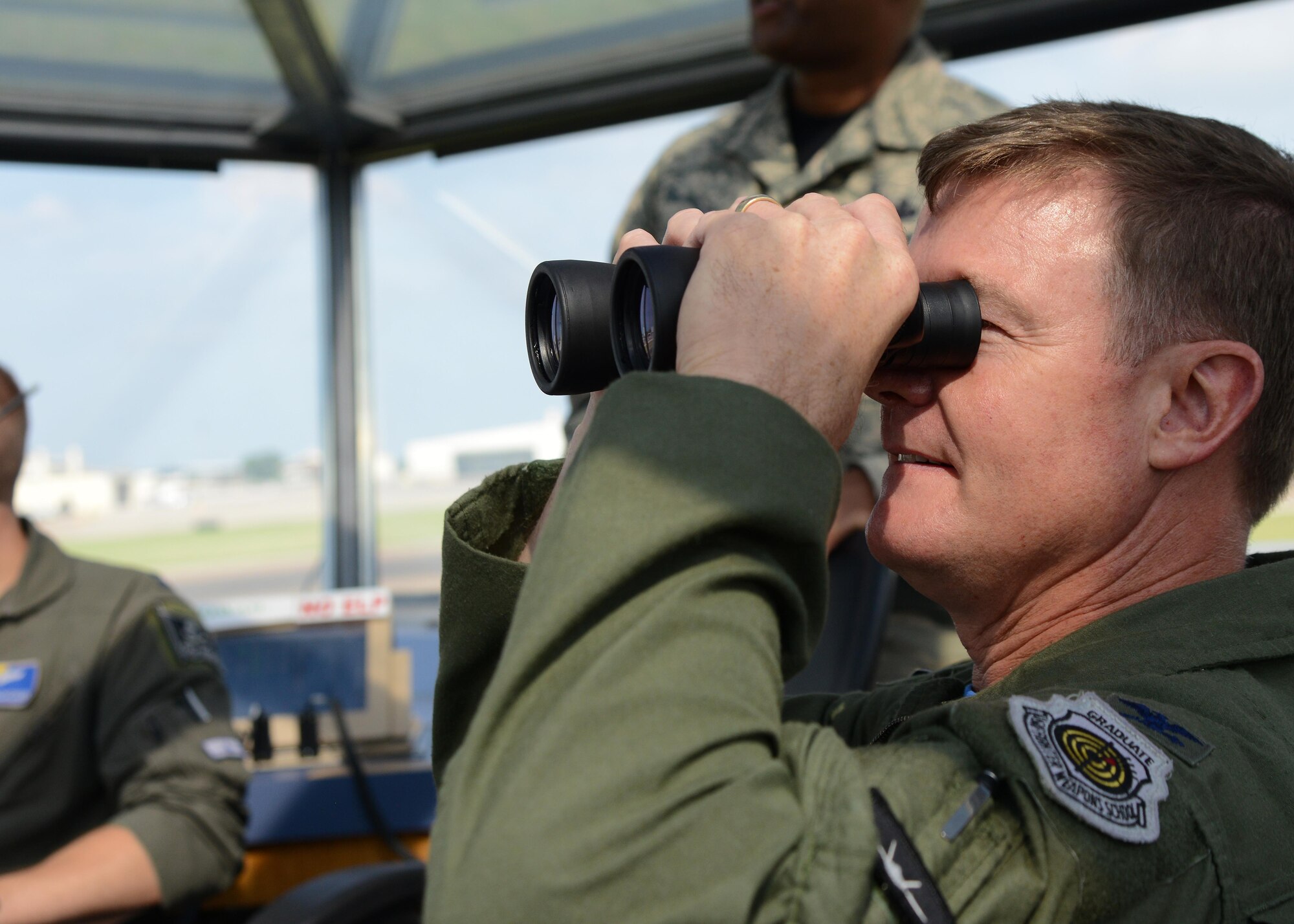 Col. Thomas Shank, 47th Flying Training Wing commander, looks down the runway at Laughlin Air Force Base, June 16, 2017. Shank visited the Runway Supervisory Unit with Chief Master Sgt. Ronald Harper, 47th Mission Support Group superintendent, and the two had an opportunity to learn more about what an RSU controller does on a daily basis. (U.S. Air Force photo/Airman 1st Class Benjamin N. Valmoja)