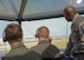 Col. Thomas Shank, 47th Flying Training Wing commander, Capt. Brandon Gaines-Richcreek, 47th Student Squadron instructor pilot, and Chief Master Sgt. Ronald Harper, 47th Mission Support Group superintendent (left to right), watch as the first aircraft in a four-ship formation takes off at Laughlin Air Force Base, June 16, 2017. Shank and Harper had an opportunity to take control in the Runway Supervisory Unit, giving the inbound and outbound aircraft instructions as they navigate the runway. (U.S. Air Force photo/Airman 1st Class Benjamin N. Valmoja)