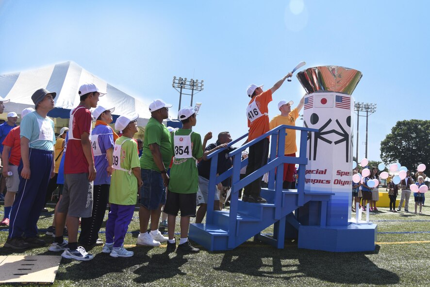 A competitor lights the Olympic flame at the 38th Annual Kanto Plains Special Olympics opening ceremony at Yokota Air Base, Japan, June 17, 2017. The Special Olympics is a global organization. The Non Commissioned Officers Association established the KPSO program at Yokota Air Base, Japan with only three athletes from the Department of Defense Education Activity in 1980. In 1984, the KPSO became a separate private organization. (U.S. Air Force
photo by Machiko Arita)
