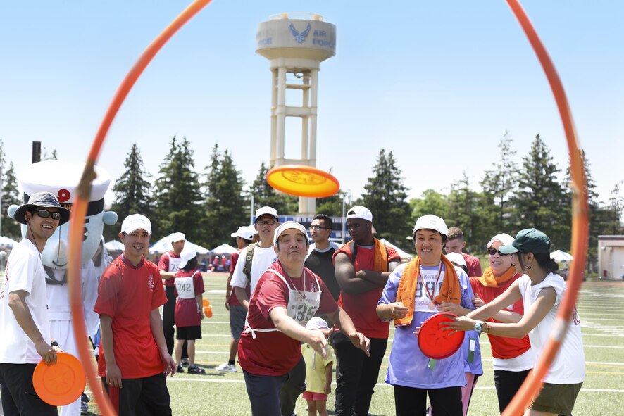 A competitor throws a flying disc during the 38th Annual Kanto Plains Special Olympics at Yokota Air Base, Japan, June 17, 2017. 127 athletes from eight local schools and the Department of Defense Education Activity throughout the Kanto Plain region competed in various sports ranging from the track and field and bowling to basketball and swimming. (U.S.Air Force photo by Machiko Arita)