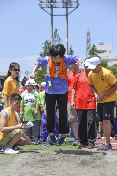 A competitor competes in the standing long jump during the 38th Annual Kanto Plains Special Olympics at Yokota Air Base, Japan, June 17, 2017. 127 athletes from eight local schools and the Department of Defense Education Activity throughout the Kanto Plain region competed in various sports ranging from the track and field and bowling to basketball and swimming. (U.S. Air Force photo by Machiko Arita)