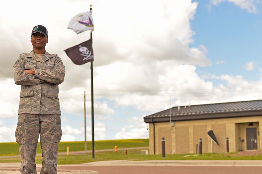 Air Force Senior Airman Jasmine Helm-Lucas, a munitions controller with the 341st Munitions Squadron, poses for a photo at Malmstrom Air Force Base, Mont., June 19, 2017. Helm-Lucas acts as a gatekeeper for granting maintenance airmen access to the weapons storage area where they will perform maintenance on intercontinental ballistic missiles’ reentry systems and vehicles. Air Force photo by Airman 1st Class Daniel Brosam