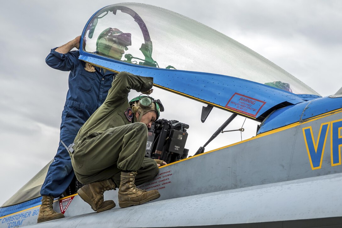 Marines perform maintenance on an F/A-18C Hornet aircraft at Joint Base Elmendorf-Richardson, Alaska, June 19, 2017, during exercise Red Flag-Alaska 17-2. The Marines are assigned to Marine Fighter Attack Squadron 251. Marine Corps photo by Lance Cpl. Koby I. Saunders