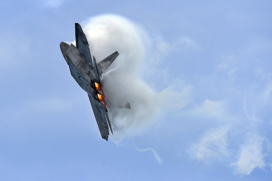 A pilot with the Air Force’s F-22 Raptor Demonstration Team performs during the OC Air Show in Ocean City, Md., June 17, 2017. The jet flew alongside an A-10 Thunderbolt II and two P-51 Mustangs during the performance. Air Force photo by Senior Airman Kimberly Nagle