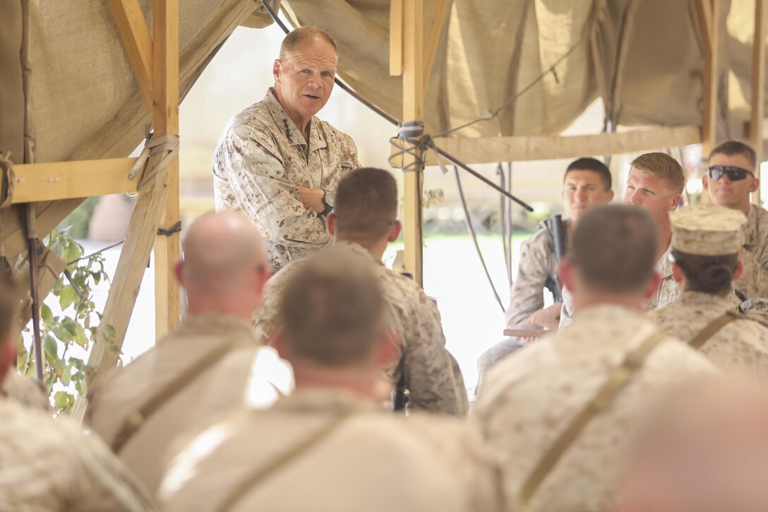 Commandant of the Marine Corps Gen. Robert B. Neller speaks to Marines and Sailors with Task Force Southwest at Camp Shorab Afghanistan, June 20, 2017. Neller discussed current events throughout the Marine Corps and reaffirmed its commitment to the Task Force’s mission of training, advising and assisting the 505th Zone National Police and Afghan National Army 215th Corps. (U.S. Marine Corps photo by Sgt. Lucas Hopkins)