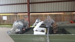 Louisiana National Guard Cadet Hunter Fontenot and Spc. Jason Albritton, of 769th Brigade Engineer Battalion, 256th Infantry Brigade Combat Team, inspect boats ahead of the possible response to Tropical Storm Cindy. More than 80 high-water vehicles and 33 boats have been staged in 14 parishes. 