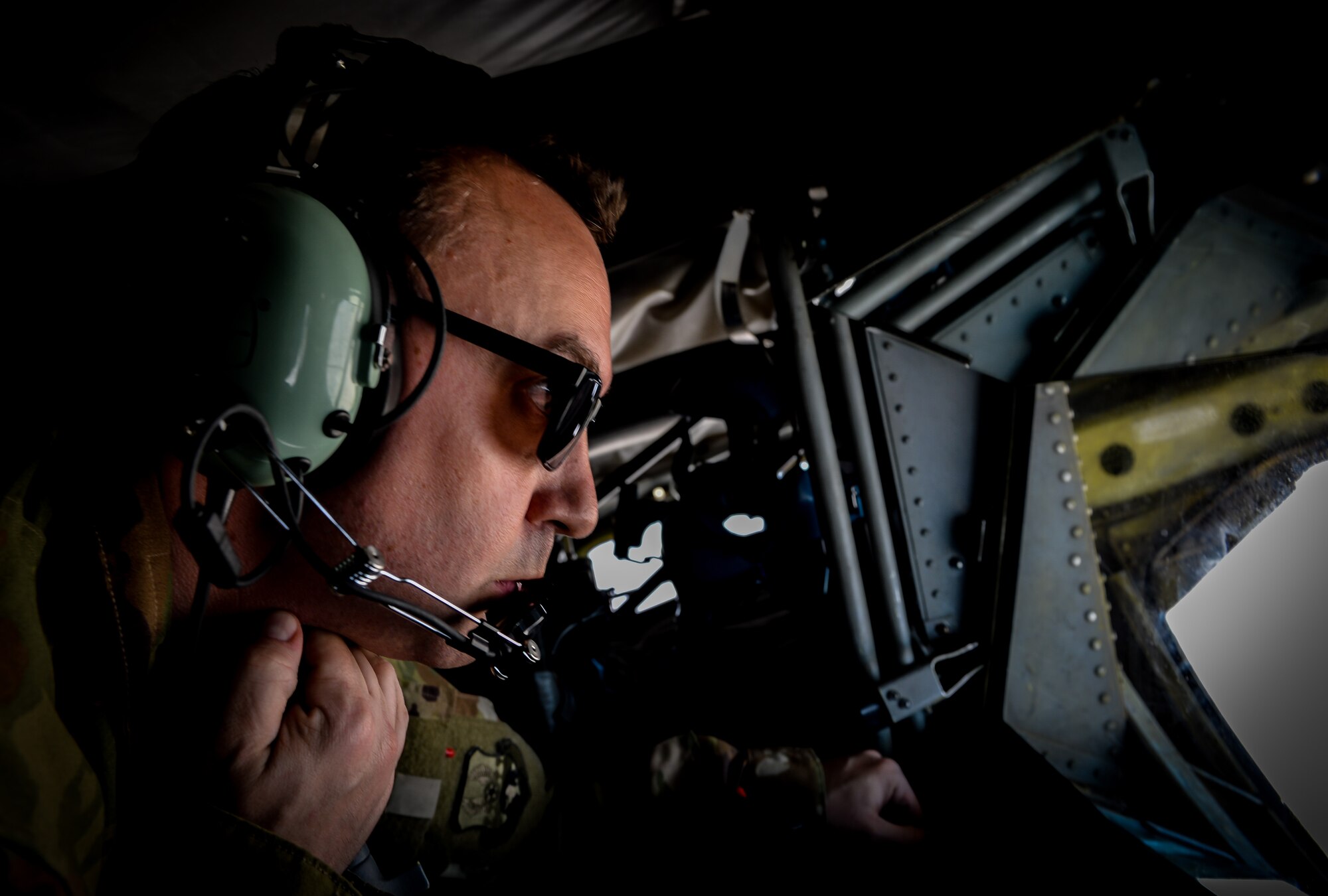 Master Sgt. Dillon Poole, 340th Expeditionary Air Refueling Squadron boom operator, awaits the arrival of a F-22 Raptor during an air refueling mission in support of Operation Inherent Resolve, June 20, 2017. The KC-135 provides aerial refueling capabilities as it supports U.S. and coalition forces working to liberate territory and people under the control of ISIS. (U.S. Air Force photo by Staff Sgt. Michael Battles)