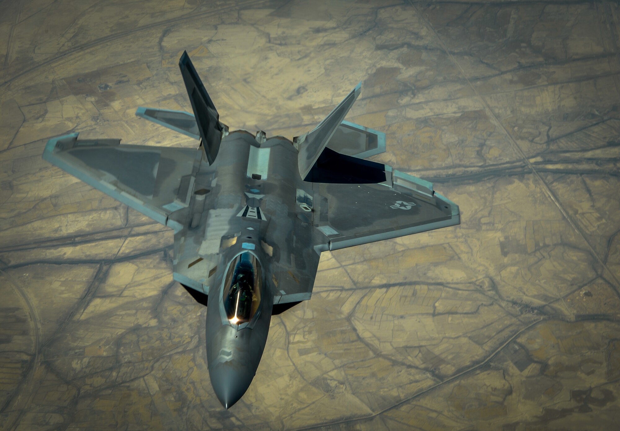 An F-22 Raptor departs after receiving fuel from a KC-135 Stratotanker assigned to the 340th Expeditionary Air Refueling Squadron during a mission in support of Operation Inherent Resolve, June 20, 2017. The F-22 is a component of the Global Strike Task Force, supporting U.S. and coalition forces working to liberate territory and people under the control of ISIS. (U.S. Air Force photo by Staff Sgt. Michael Battles) 