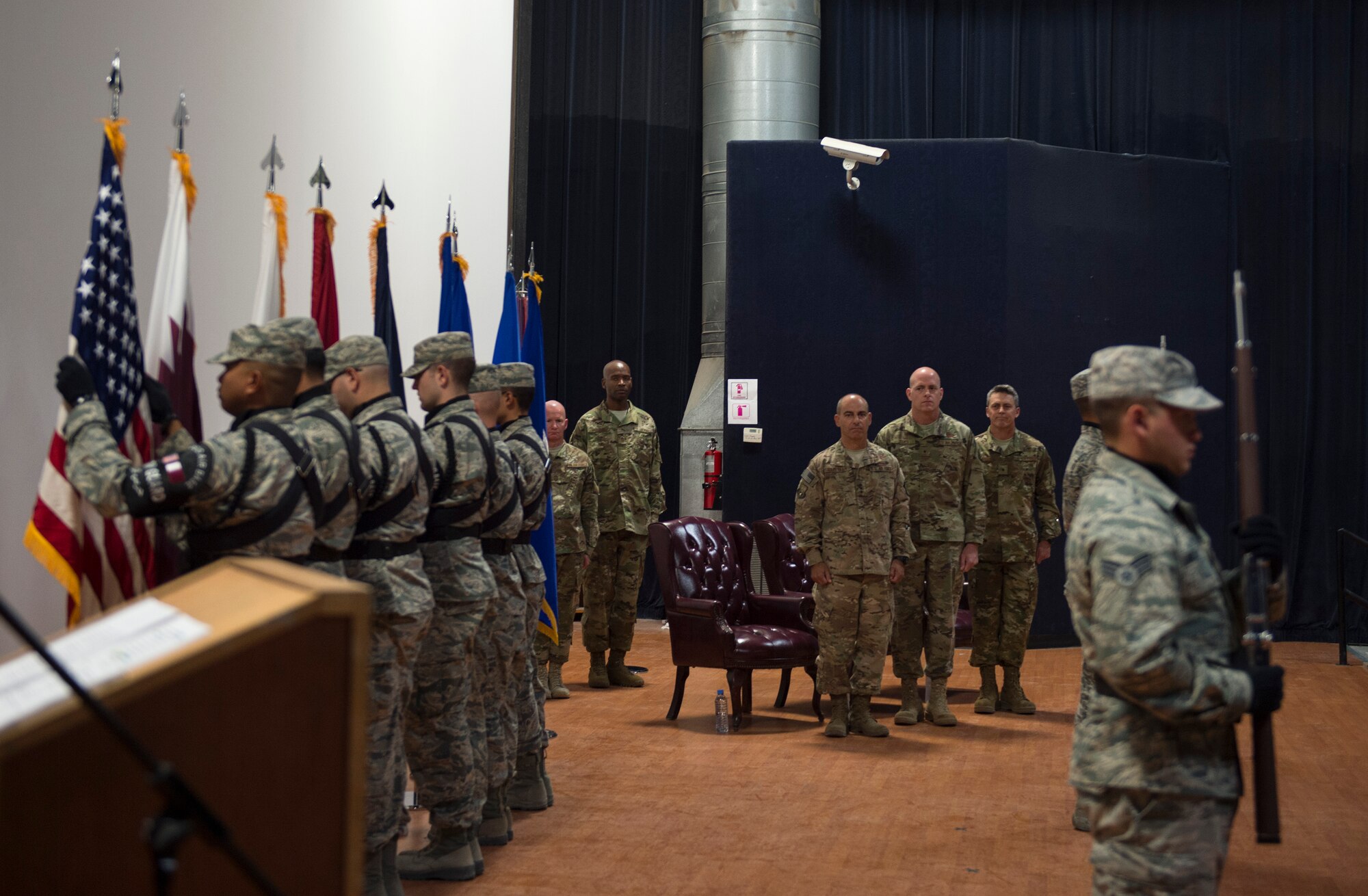 The colors are presented during the 379th Air Expeditionary Wing change of command ceremony June 12, 2017, at Al Udeid Air Base, Qatar. U.S. Air Force Lt. Gen. Jeffrey L. Harrigian, commander of U.S. Air Forces Central Command, center left, presided over the ceremony in which Brig. Gen. Darren V. James, 379th AEW commander, relinquished command to Brig. Gen. Jason R. Armagost. (U.S. Air Force photo by Tech. Sgt. Amy M. Lovgren)