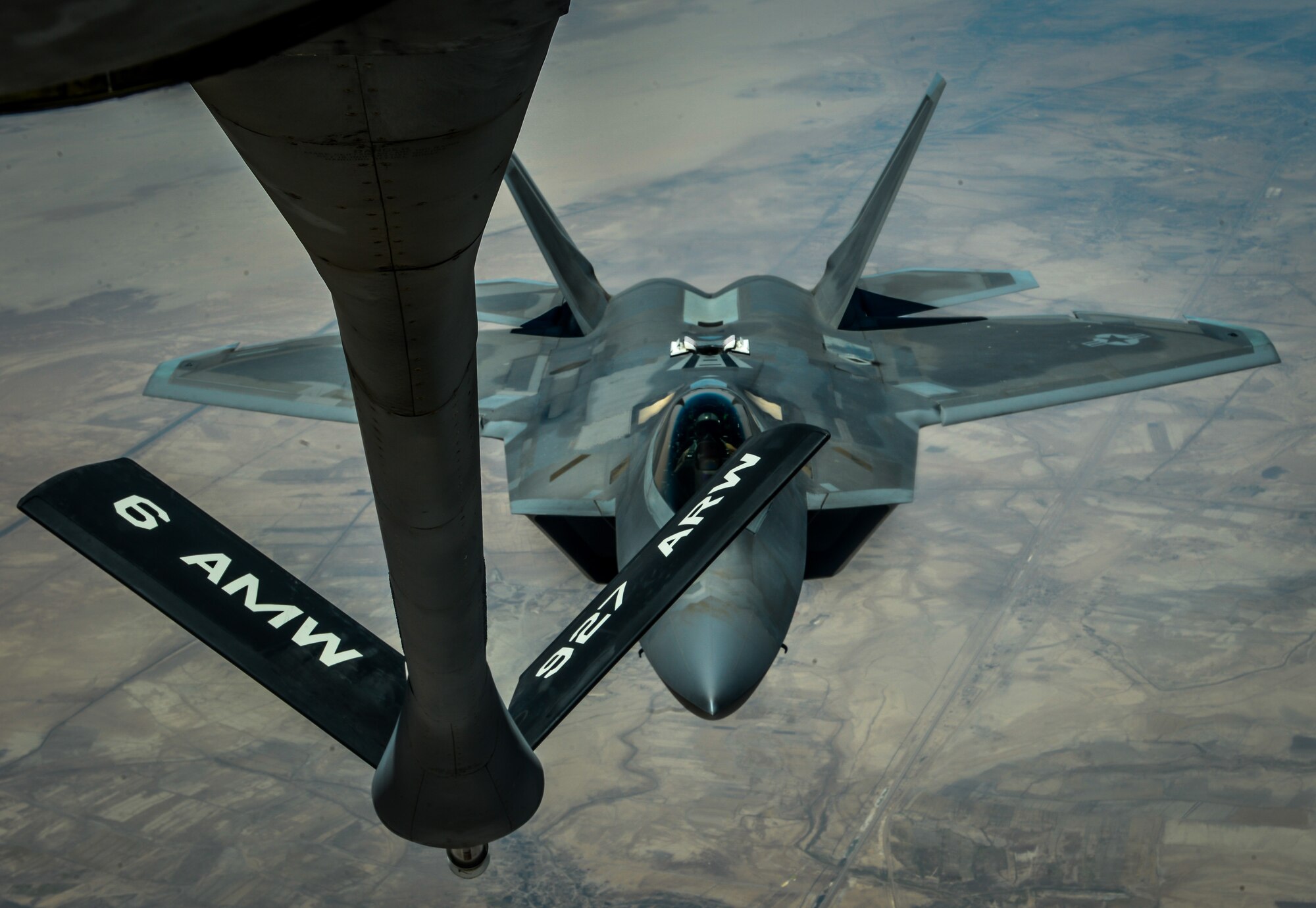 An F-22 Raptor prepares to receive fuel from a KC-135 Stratotanker assigned to the 340th Expeditionary Air Refueling Squadron during a mission in support of Operation Inherent Resolve, June 20, 2017. The F-22 is a component of the Global Strike Task Force, supporting U.S. and coalition forces working to liberate territory and people under the control of ISIS. (U.S. Air Force photo by Staff Sgt. Michael Battles) 