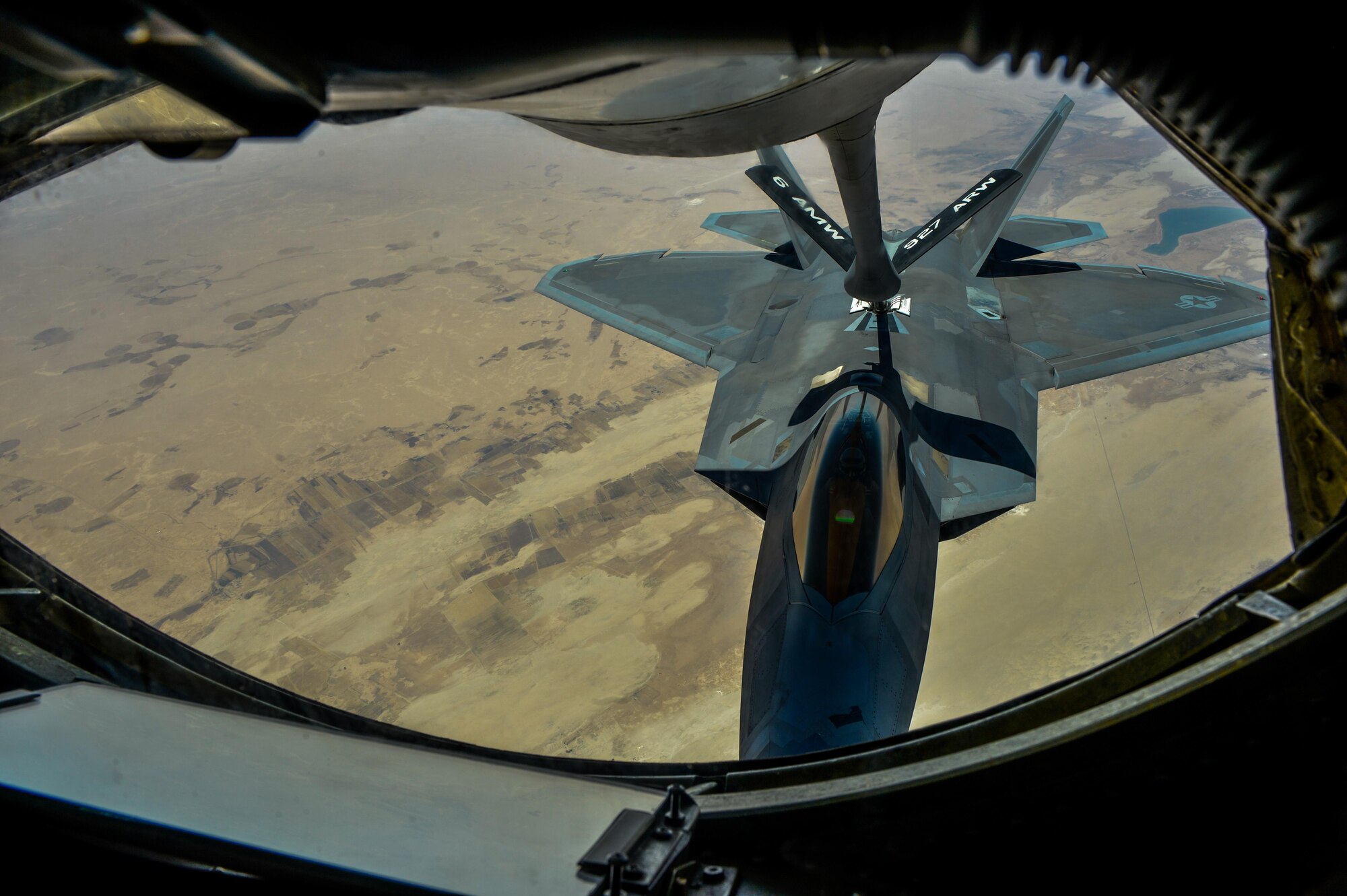 An F-22 Raptor receives fuel from a KC-135 Stratotanker assigned to the 340th Expeditionary Air Refueling Squadron during a mission in support of Operation Inherent Resolve, June 20, 2017. The F-22 is a component of the Global Strike Task Force, supporting U.S. and coalition forces working to liberate territory and people under the control of ISIS. (U.S. Air Force photo by Staff Sgt. Michael Battles)