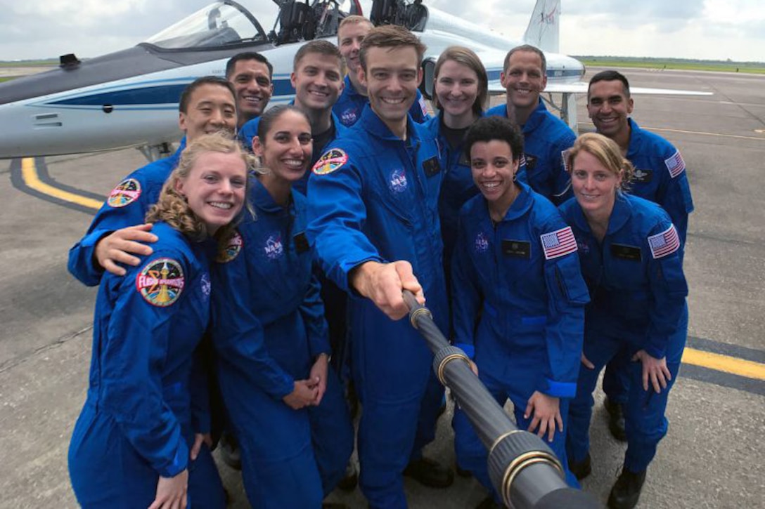 NASA’s 2017 astronaut candidates stop to take a group photo while getting fitted for flight suits at Ellington Field near NASA’s Johnson Space Center in Houston. Photo courtesy: NASA