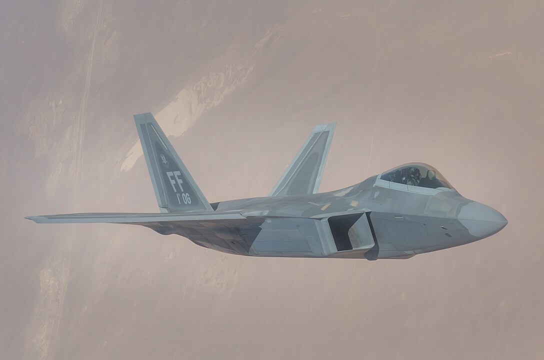 A U.S. Air Force F-22 Raptor departs after receiving fuel from a 340th Expeditionary Air Refueling Squadron KC-135 Stratotanker during a flight in support of Operation Inherent Resolve June 21, 2017. The F-22, a component of the Global Strike Task Force, supports U.S. and coalition forces working to liberate territory and people under the control of ISIS. (U.S. Air Force photo by Staff Sgt. Trevor T. McBride)
