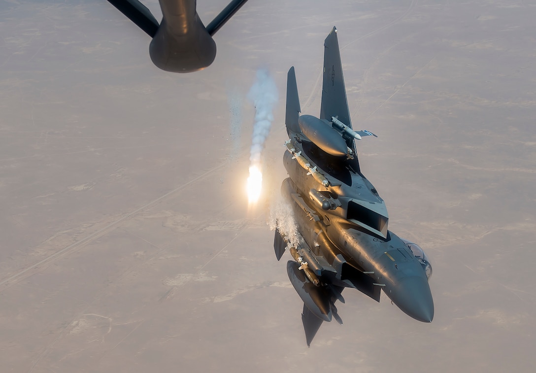 A U.S. Air Force F-15E Strike Eagle fires flares during a flight in support of Operation Inherent Resolve June 21, 2017. The F-15, a component of U.S. Air Forces Central Command, supports U.S. and coalition forces working to liberate territory and people under the control of ISIS. (U.S. Air Force photo by Staff Sgt. Trevor T. McBride)