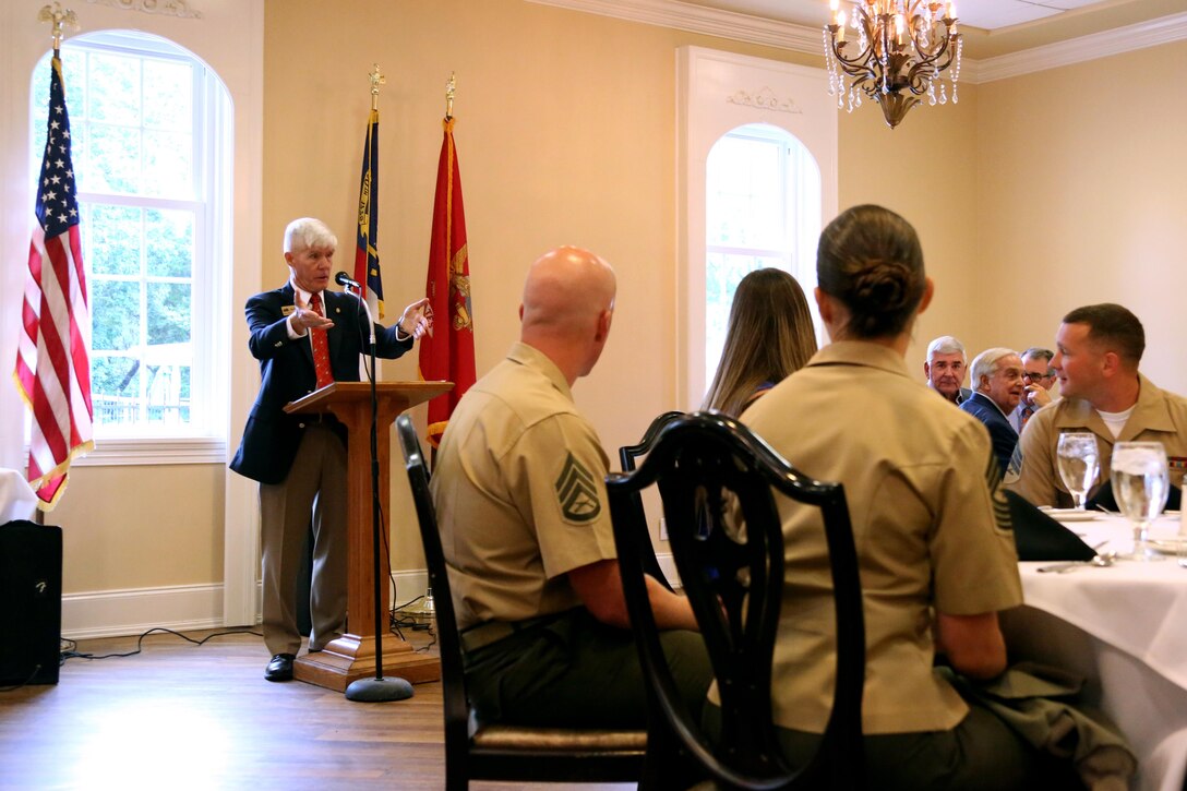 Retired U.S. Marine Corps Maj. Gen. Tom Braaten gives a speech about Sgt. Shaun and Lindsay Monaghan’s volunteering efforts during a Military Family of the Quarter recognition ceremony at the New Bern, N.C., Golf and Country Club, June 9, 2017. Shaun is an intermediate level ordnance instructor for the Center for Naval Aviation Technical Training at Marine Corps Air Station Cherry Point, N.C. Lindsay is a former U.S. Army motor transportation operator who has volunteered approximately 300 hours at Merci Clinic in New Bern. Braaten is a former commanding general of MCAS Cherry Point. (Marine Corps photo by Cpl. Jason Jimenez/ Released)