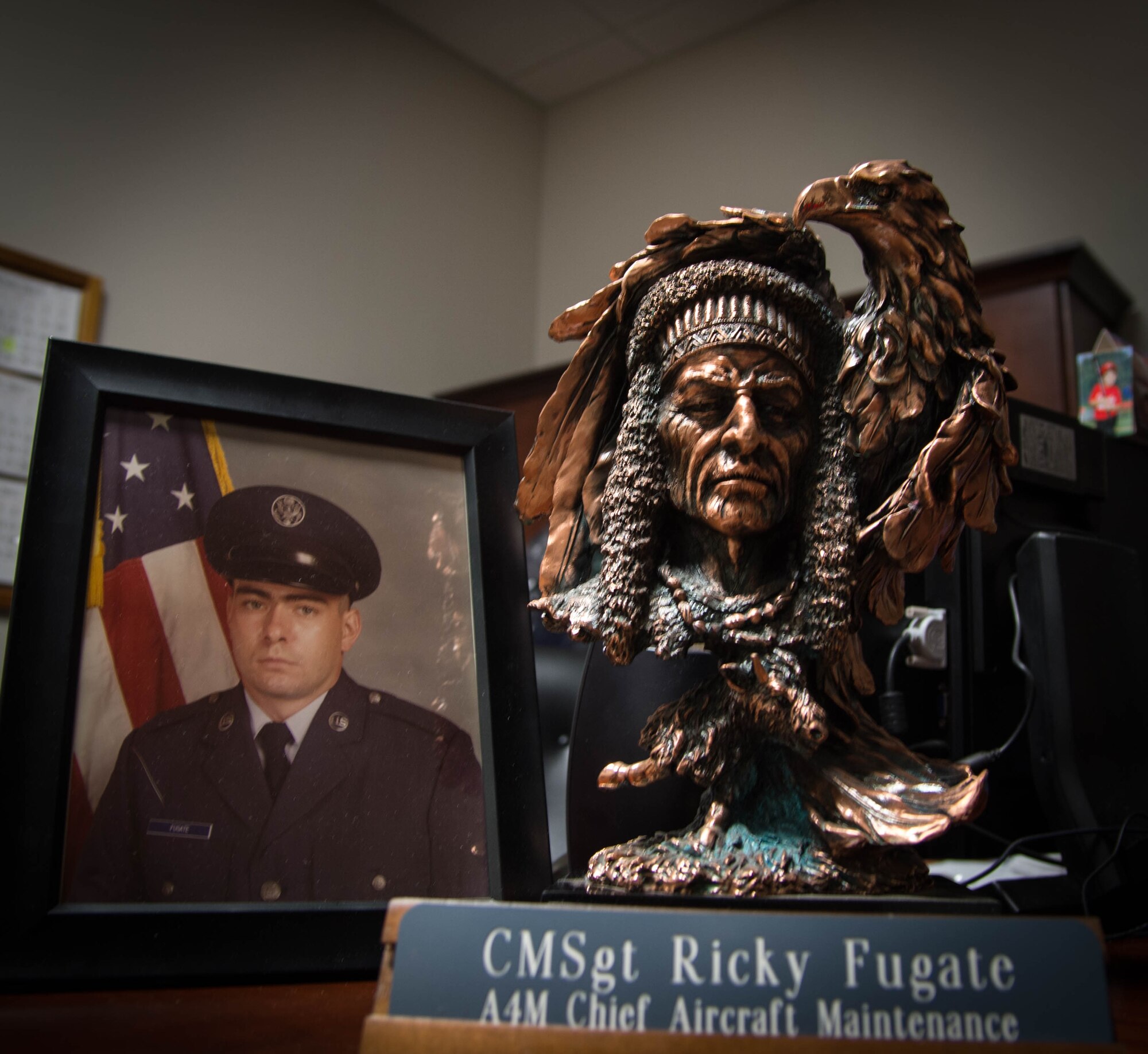 Memorabilia covers the desk of Chief Master Sgt. Ricky Fugate at Dyess Air Force Base, Texas, June 3, 2017. Fugate is assigned to the 489th Maintenance Squadron and is retiring after 34 years of service.