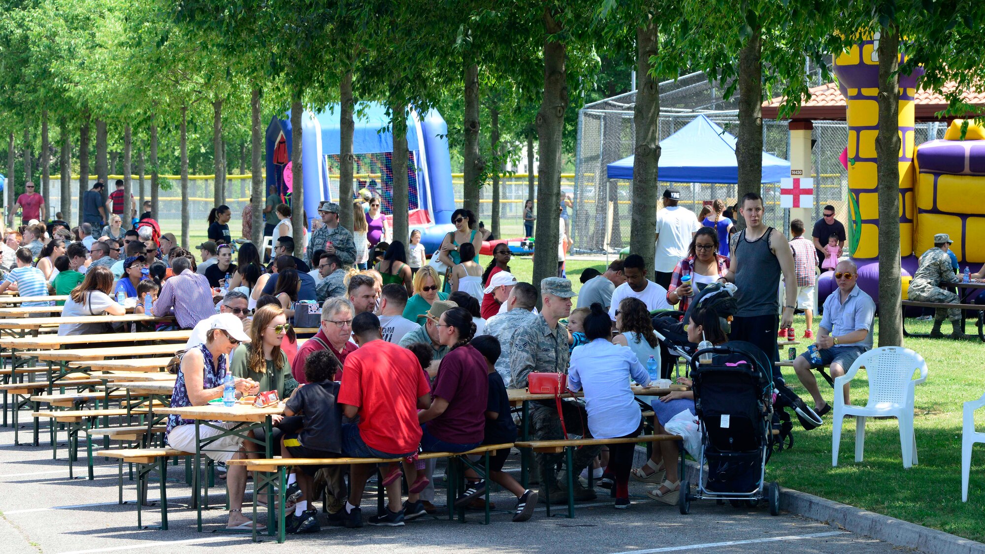 Team Aviano attends the annual wing picnic, June 15, 2017, at Aviano Air Base, Italy. The picnic offered free food, games, bouncy castles and live music by “American Hitmen”. (U.S. Air Force photo by Airman 1st Class Ryan Brooks)