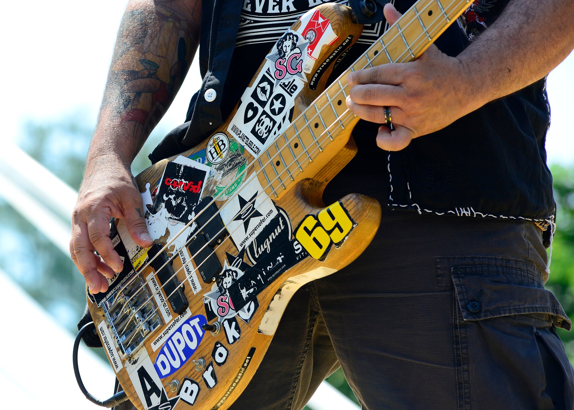 The “American Hitmen” bass player jams to a rock song during the annual wing picnic, June 15, 2017, at Aviano Air Base, Italy. The band performed rock hits throughout the day to show appreciation to service members and their families. (U.S. Air Force photo by Airman 1st Class Ryan Brooks)