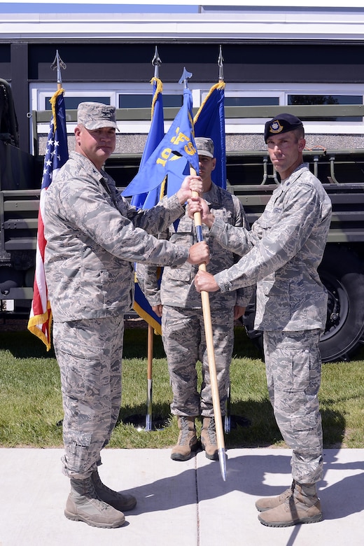 Col. Ken Ohlson (left),10th Mission Support Group commander, hands Lt. Col. Marcus Corbett the 10th Security Forces Squadron guidon June 21, 2017 at the 10th SFS change of command ceremony at the U.S. Air Force Academy. (U.S. Air Force photo/Mile Kaplan)