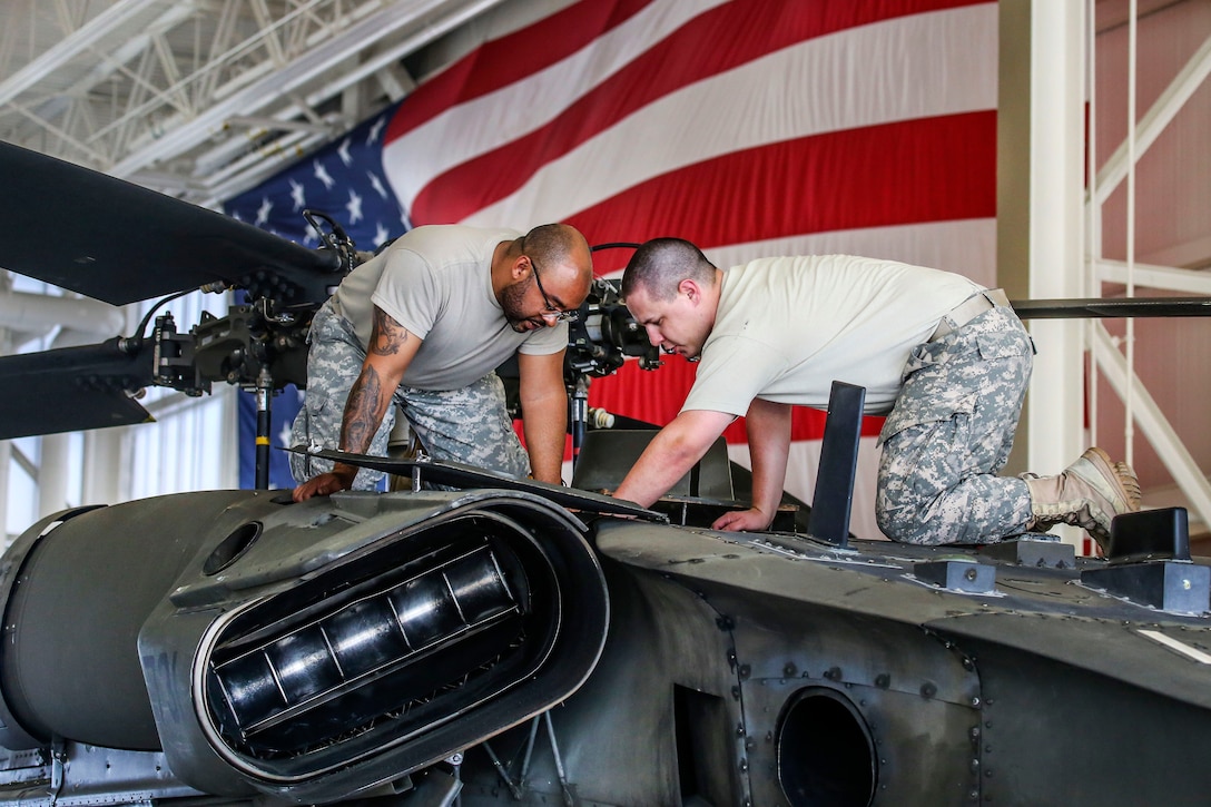 New Jersey Army National Guardsmen perform scheduled maintenance on UH-60 Black hawk helicopters in the main hangar of the Army Aviation Support Facility at Joint Base McGuire-Dix-Lakehurst, N.J., June 14, 2017. New Jersey Air National Guard photo by Master Sgt. Matt Hecht