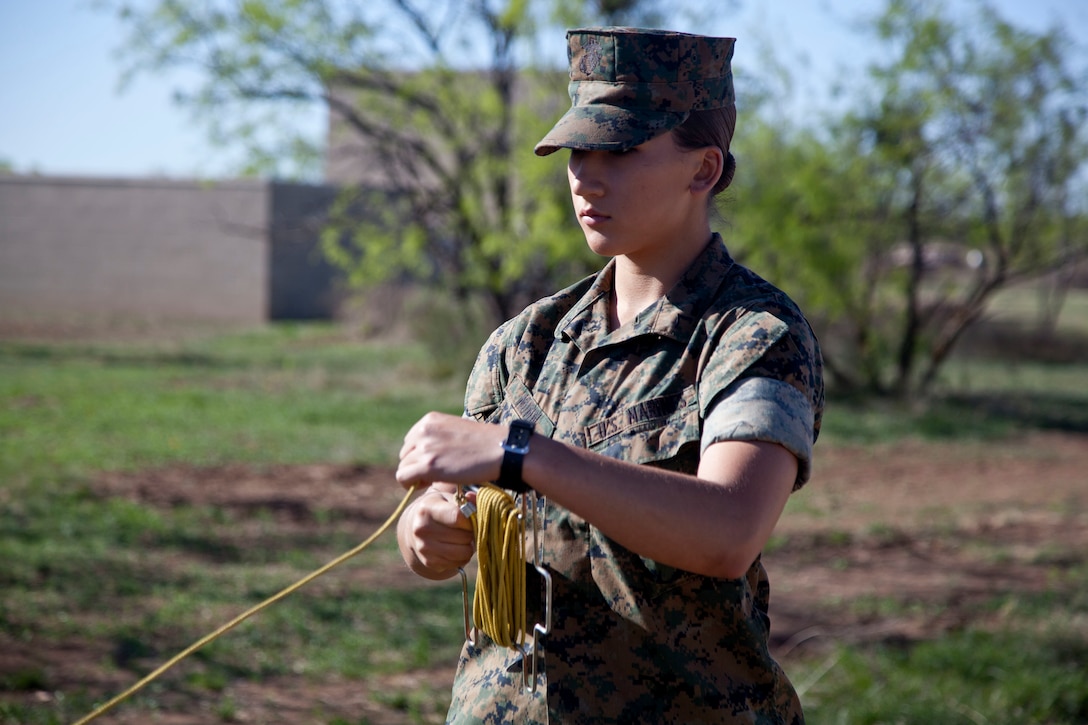 U.S. Marine Corps Pfc. Sydney I. Munn, a student assigned to the Tactical Signals Intelligence Operators Course, Marine detachment Goodfellow, sets up a 8 Meter Collapsable Mast Assembly at Joint Airforce Base Goodfellow, Texas, March 24, 2017. The mission of Marine Detachment Goodfellow is to train Marines in the occupational fields of Fire Protection and Signals Intelligence for the Fleet Marine Force. (U.S. Marine Corps photo by Lance Cpl. Jose Villalobosrocha)