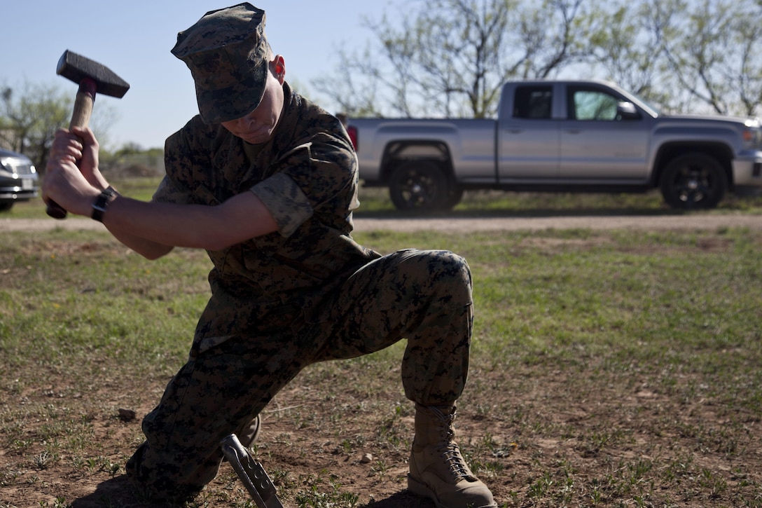 A U.S. Marine assigned to the Tactical Signals Intelligence Operators Course, Marine detachment Goodfellow, sets up a 8 Meter Collapsable Mast Assembly at Joint Airforce Base Goodfellow, Texas, March 24, 2017. The mission of Marine Detachment Goodfellow is to train Marines in the occupational fields of Fire Protection and Signals Intelligence for the Fleet Marine Force. (U.S. Marine Corps photo by Lance Cpl. Jose Villalobosrocha)