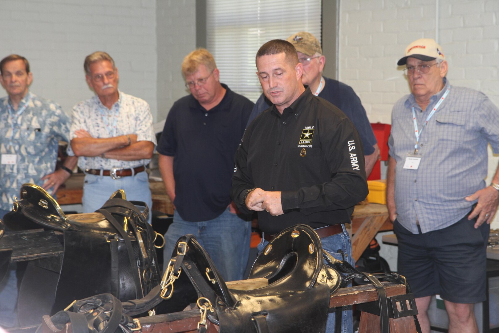 Sgt. 1st Class Shawn Nield, Headquarters Support Company, U.S. Army North, gives an overview of the caisson platoon and its mission of honoring fallen service members to Gold Star Fathers and family members June 17. The group visited Joint Base San Antonio-Fort Sam Houston as part of the 80th Annual American Gold Star Mothers, Inc., National Convention held in San Antonio. The American Gold Star Mothers organization formed in 1928 of mothers who lost a son or daughter in service to the nation. The organization and the members continue to honor their sons and daughters through service to veterans and patriotic events.