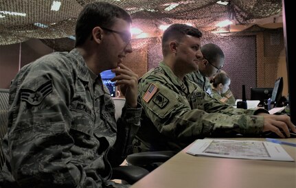U.S. Air National Guard Senior Airman Benjamin McMahon, currently assigned to the 112th Cyber Operations Squadron, out of Hirsham, Pennsylvania, and Sgt. 1st Class Matthew R. Wagner, a senior information systems analyst with the North East Cyber Protection Center, a unit part of the Army Reserve Cyber Operations Group (ARCOG), 335th Signal Command (Theater), participate in a training exercise during the Cyber X-Games, hosted by the ARCOG, June 16 at Carnegie Mellon University. Cyber X-Games is a five-day exercise focusing on advanced areas of cyber security training. Cyber X-Games is also part of Cyber Endeavour, the Department of Defense-sponsored conference for military and civilian practitioners from across government, industry and academia to address the nexus of cyberspace and national security. (U.S. Army Reserve photo by Sgt. Erick Yates)