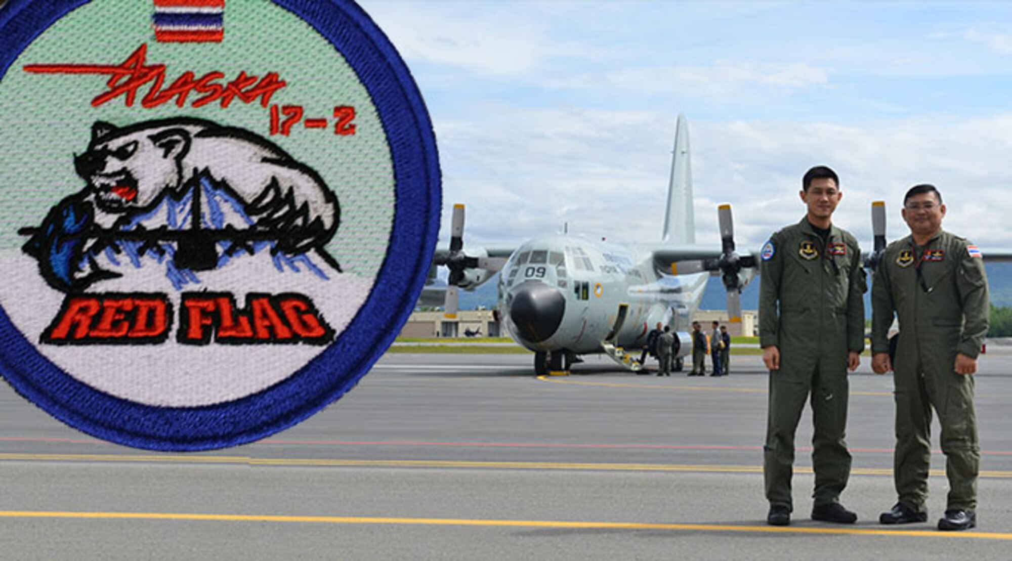 Two Royal Thai Air Force Airmen stand in front of their C-130 Hercules on the Joint Base Elmendorf-Richardson Flightline June 8 during Operation Red Flag-Alaska 17-2. RF-A is a Pacific Air Forces-directed field training exercise for U.S. and international forces flown under simulated air combat conditions. It is conducted on the Joint Pacific Alaska Range Complex with air operations flown primarily out of Eielson Air Force Base and JBER. (Photo by Senior Airman Kyle Johnson)