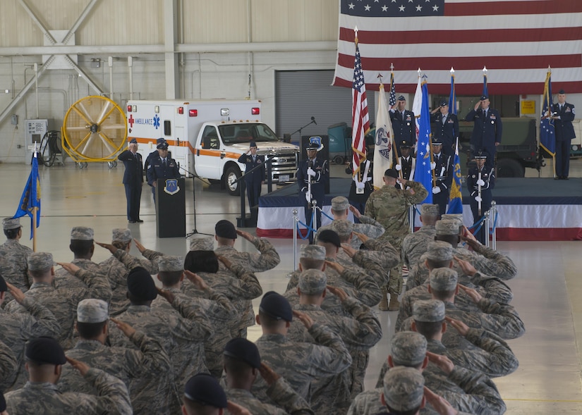 U.S. service members salute during a rendition of the national anthem at the 633rd Air Base Wing change of command ceremony Joint Base Langley-Eustis, Va., June 22, 2017. U.S. Air Force Col. Sean Tyler assumed command of the unit, which provides installation support to more than 18,000 Airmen, Soldiers and civilians across two major command headquarters, 13 operational wings and Army brigades, and more than 20 associate units. (U.S. Air Force photo/Staff Sgt. R. Alex Durbin)