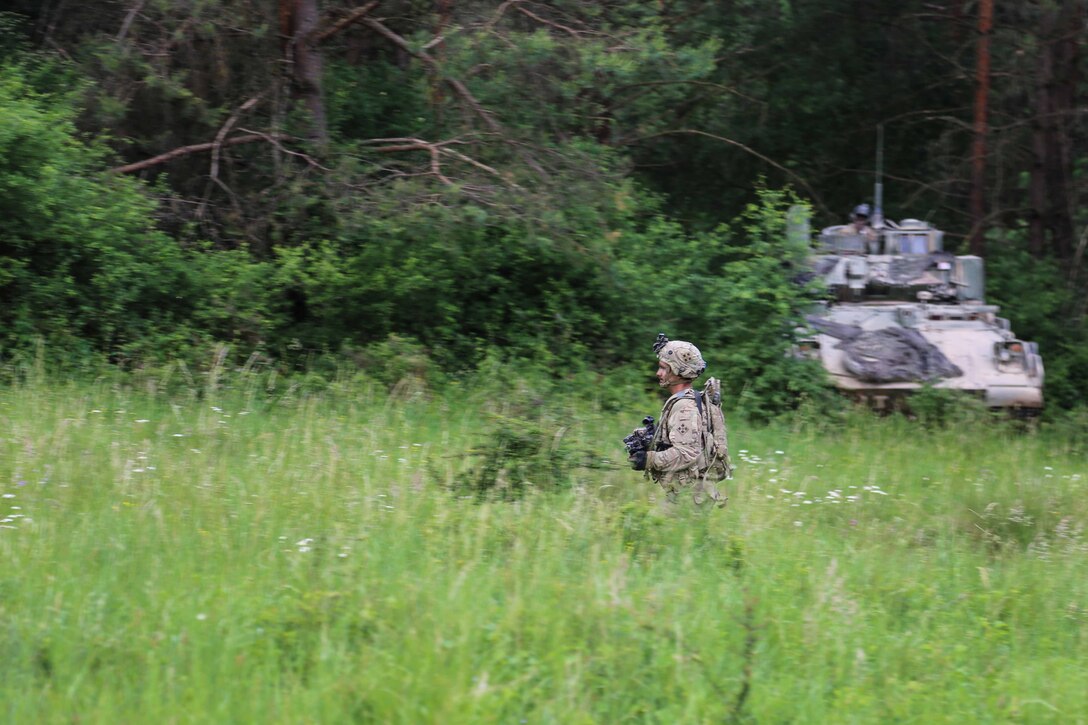 A soldier assigned to the 4th Squadron, 10th Cavalry Regiment, 4th Infantry Division maneuvers while observing and reporting enemy activities during Exercise Combined Resolve VIII at the Hohenfels Training Area, Hohenfels, Germany, June 12, 2017. Exercise Combined Resolve VIII is a multinational exercise designed to train the Army’s Regionally Allocated Forces to the U.S. European Command. Combined Resolve VIII will include more than 3,400 participants from 10 nations. The goal of the exercise is to prepare forces in Europe to operate together to promote stability and security in the region. Army photo by Sgt. Matthew Hulett