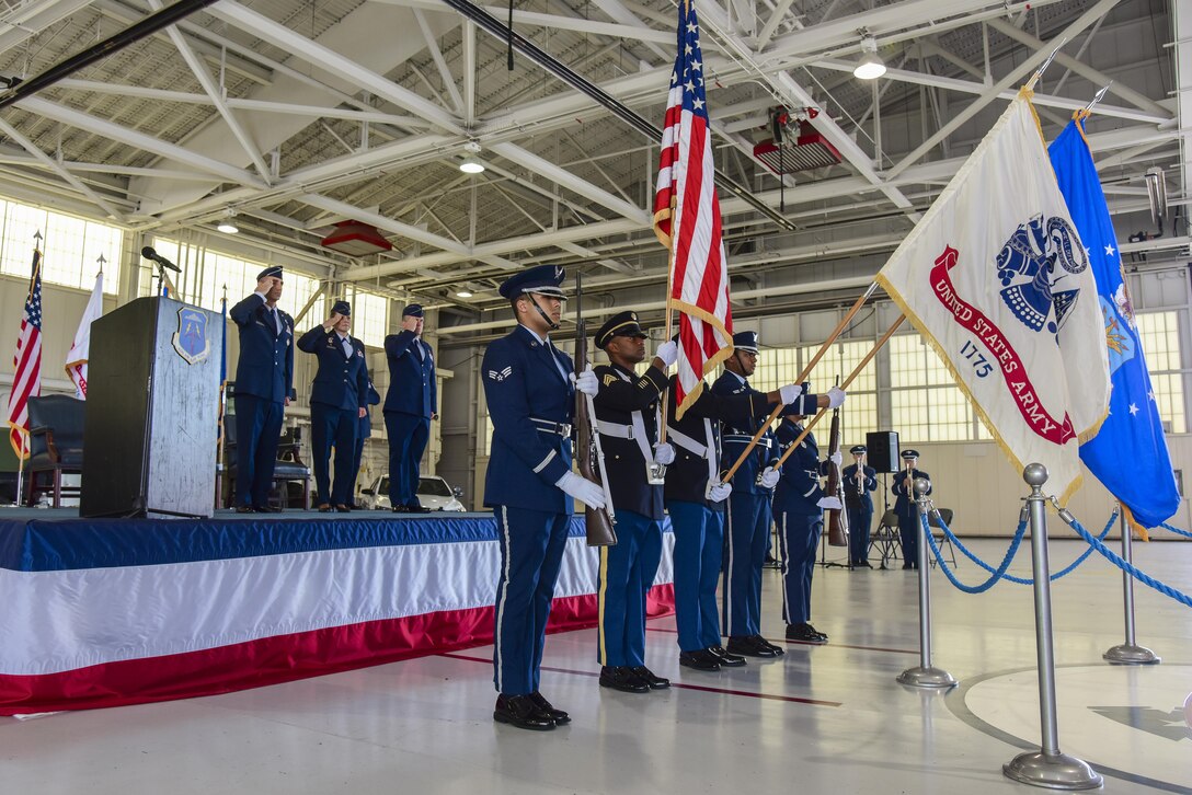 Joint honor guard members present the colors during the 633rd Air Base Wing change of command ceremony at Joint Base Langley-Eustis, Va., June 22, 2017. U.S. Air Force Col. Caroline Miller relinquished command to Col. Sean Tyler after two years of service. (U.S. Air Force photo/Airman 1st Class Tristan Biese)