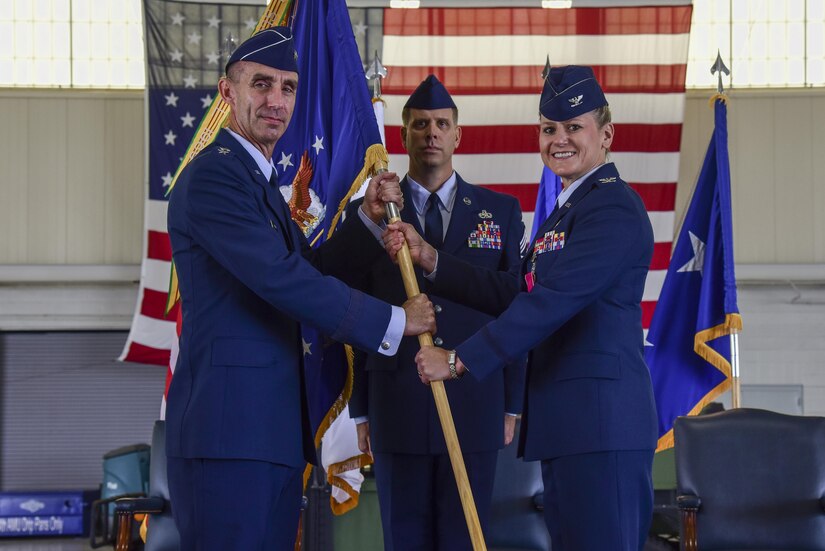 U.S. Air Force Col. Caroline Miller, 633rd Air Base Wing former commander, relinquishes command to Maj. Gen. Scott J. Zobrist, 9th Air Force commander, during the 633rd ABW change of command ceremony at Joint Base Langley-Eustis, Va., June 22, 2017. Miller served two years as commander of the 633rd ABW. (U.S. Air Force photo by Airman 1st Class Tristan Biese)