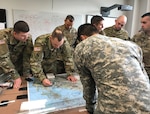 U.S. Army officers and non-commissioned officers assigned to the 1st Battalion, 69th Infantry of the New York Army National Guard work their plan for the Talisman Sabre joint training exercise with the Australian Army's 1st Brigade during a visit to Australia on May 20, 2017. 