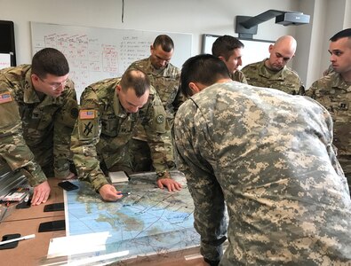 U.S. Army officers and non-commissioned officers assigned to the 1st Battalion, 69th Infantry of the New York Army National Guard work their plan for the Talisman Sabre joint training exercise with the Australian Army's 1st Brigade during a visit to Australia on May 20, 2017. 