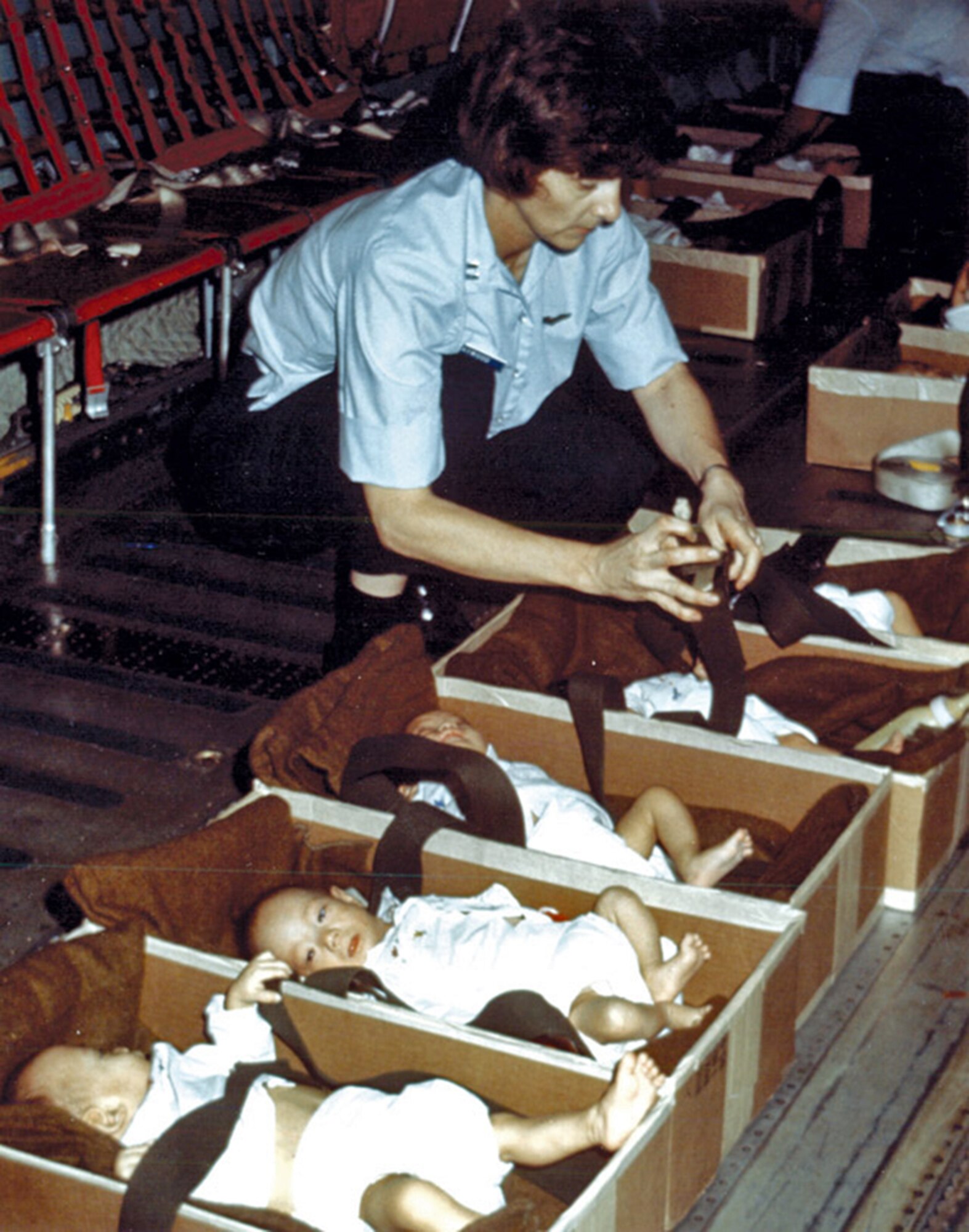 In 1975, the first all Reserve aircrew, commanded by Capt. John E. Tomkins, assisted in the evacuation of refugees from Saigon, South Vietnam. During a 17-day period, a total of five evacuation flights were flown from Saigon to the Philippines and Guam. Cardboard boxes were used to carry infants.   (Air Force File Photo)