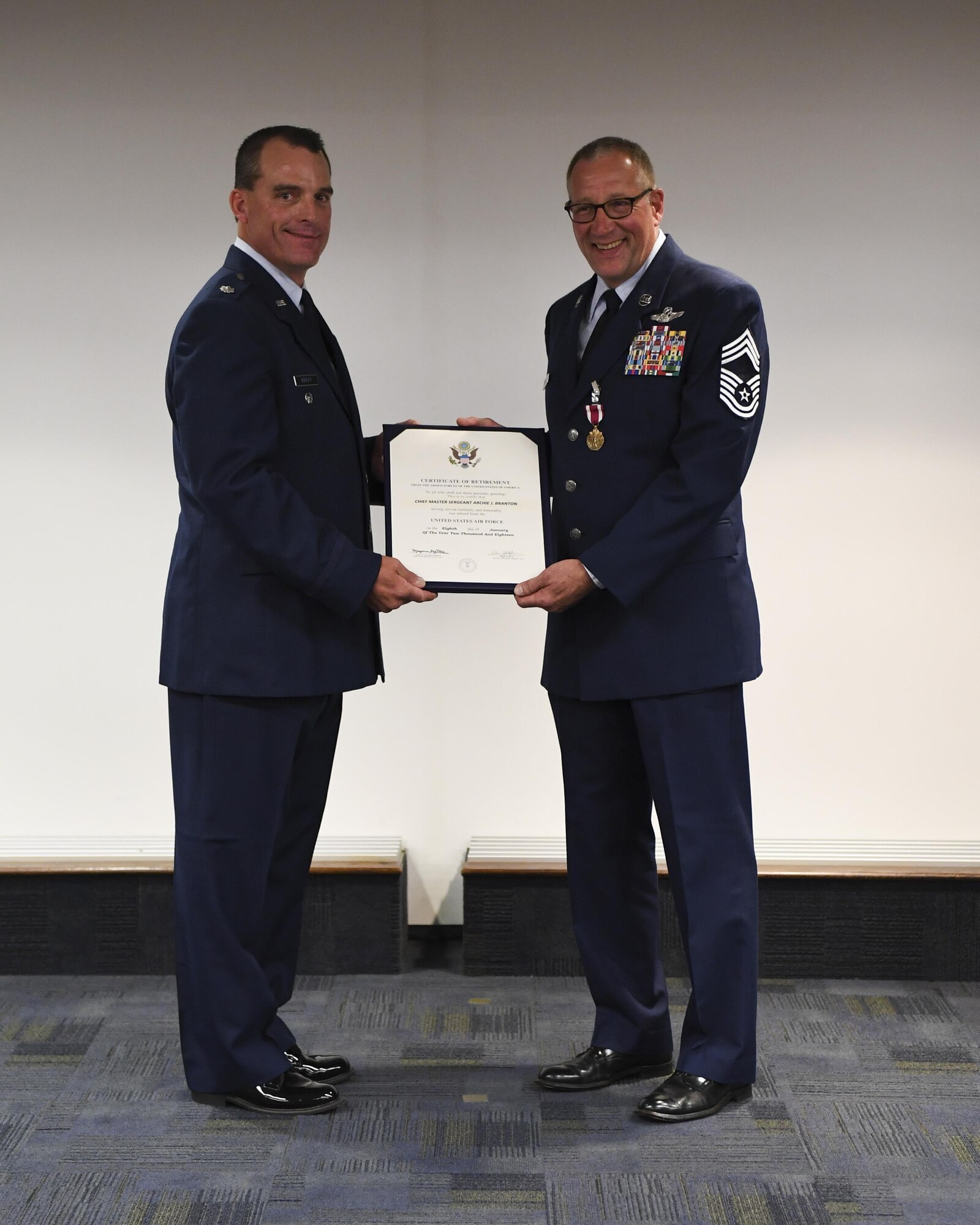 Chief Master Sgt. Archie Branton, chief loadmaster with the 758th AS, accepts his retirement certificate at the Pittsburgh International Airport Air Reserve Station, Pa., June 4, 2017. Branton ended his military career with a total of 4,406 sorties, 1,207.7 combat hours, nine air medals, four aerial achievement medals and 10,300 flying hours, 8,755 of which were in a C-130. (U.S. Air Force photo by Senior Airman Beth Kobily)