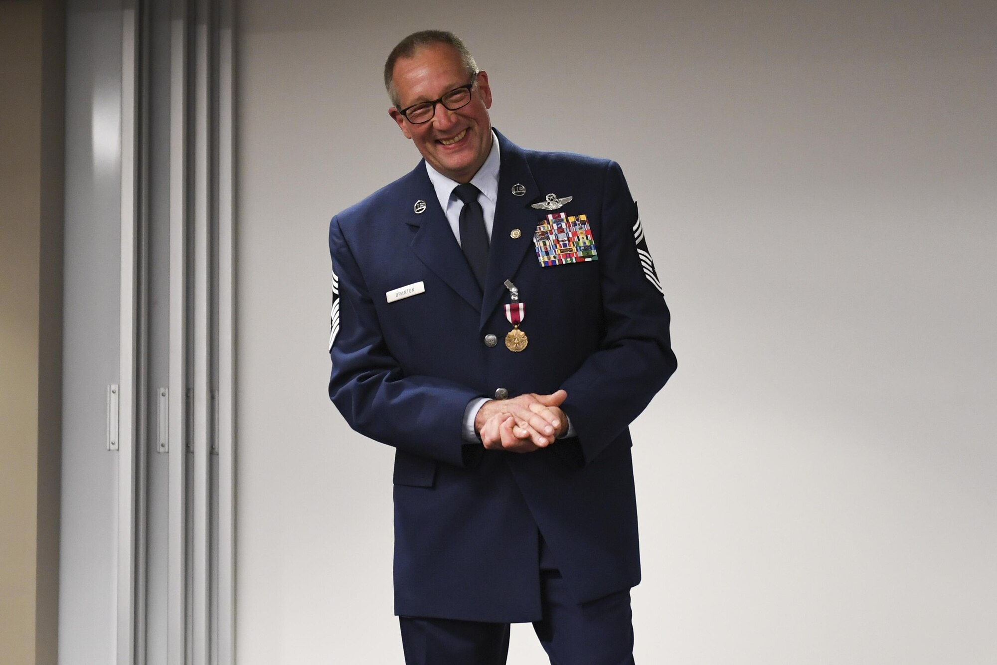 Chief Master Sgt. Archie Branton, chief loadmaster with the 758th AS, accepts his retirement certificate at the Pittsburgh International Airport Air Reserve Station, Pa., June 4, 2017. Branton ended his career with a total of 4,406 sorties, 1,207.7 combat hours, nine air medals, four aerial achievement medals and 10,300 flying hours, 8,755 of which were in a C-130. (U.S. Air Force photo by Senior Airman Beth Kobily)